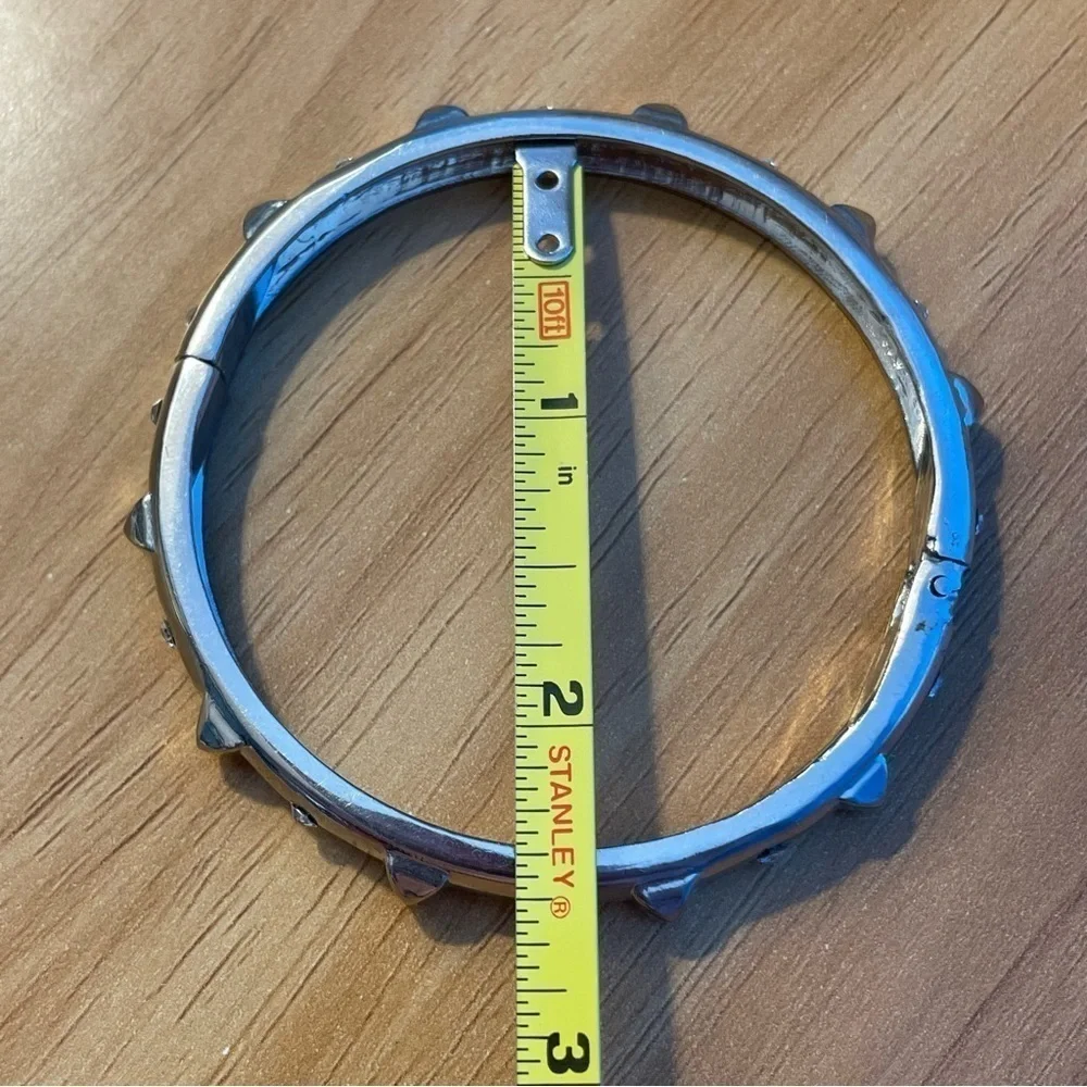 Hinged silver tone bangle bracelet with dog collar spikes and clear glass - Picture 2 of 6